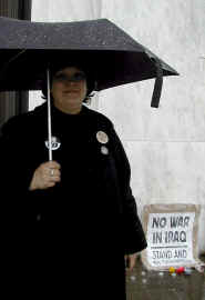 Michele Darr keeps vigil on the capitol steps.